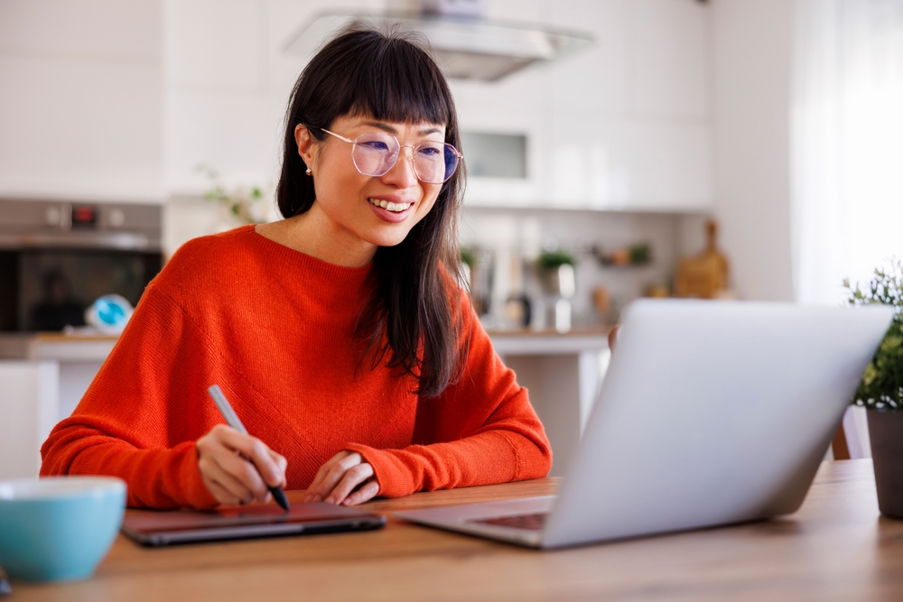 Professional woman working on a business website at her desk